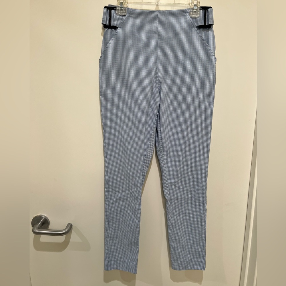 Light blue plaid pants with belt design and side zipper.